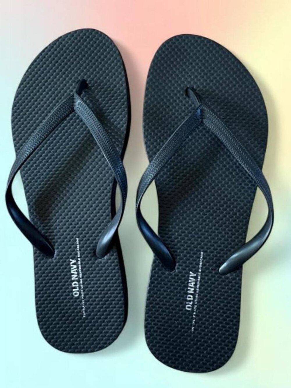 Old Navy size 8 black flip flops, never worn